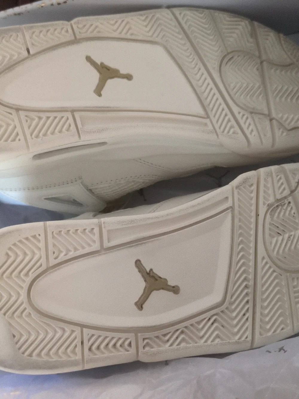Air Jordan Women's All-White Sneakers with Gold Accents